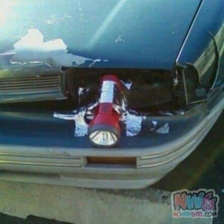 flashlight taped on a car’s headlight 
