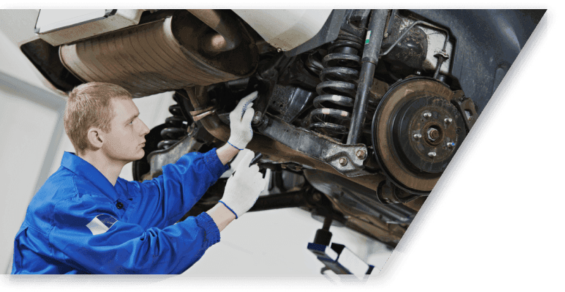 mechanic performing car maintenance in Sheridan