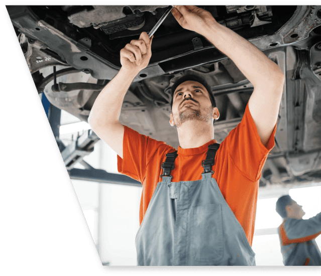 car mechanic fixing a car under