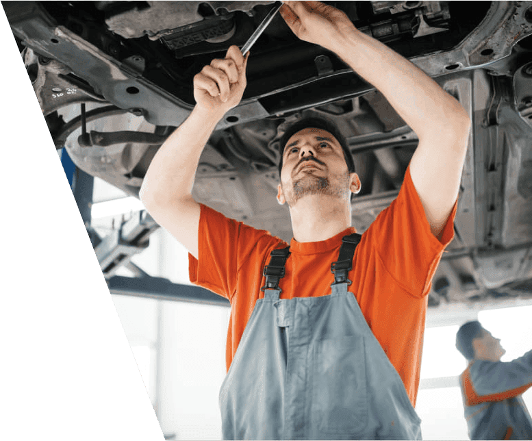 car mechanic fixing a car under