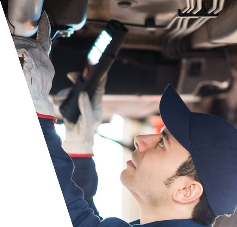 car mechanic using checking a car for repair