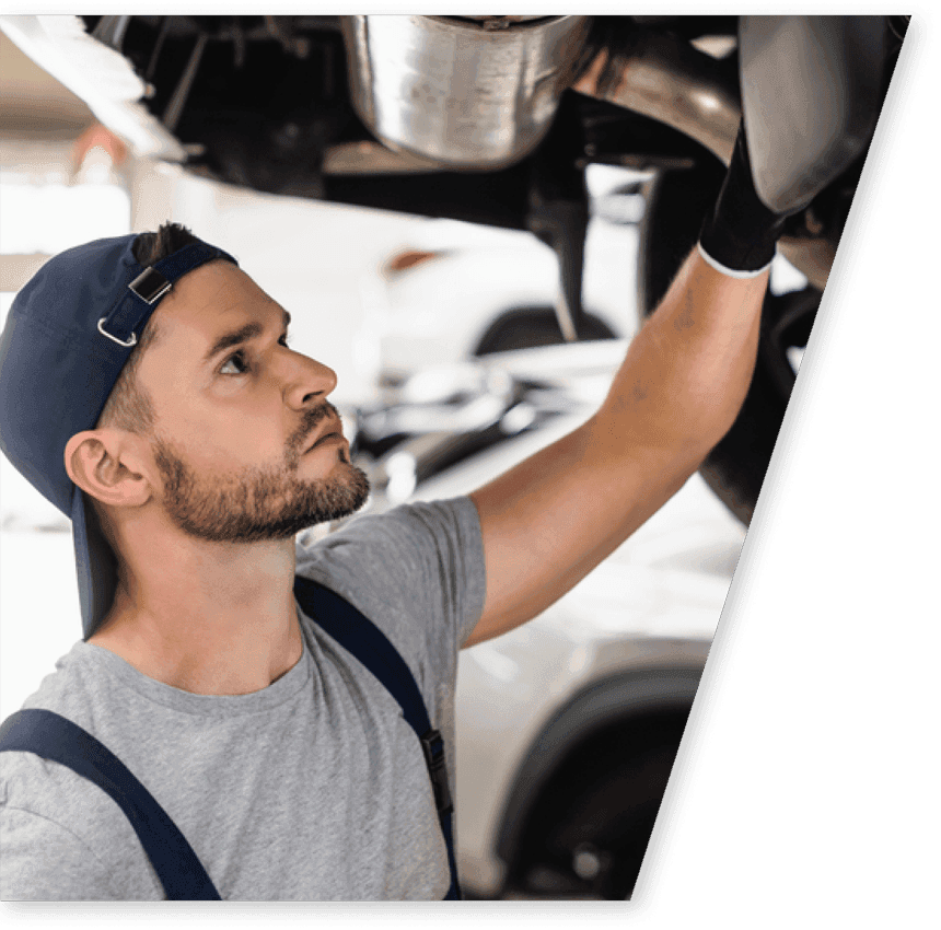 selective-focus-handsome-mechanic-cap-fixing-car