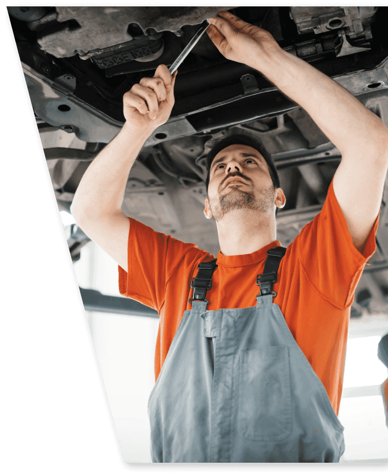 car mechanic fixing a car under