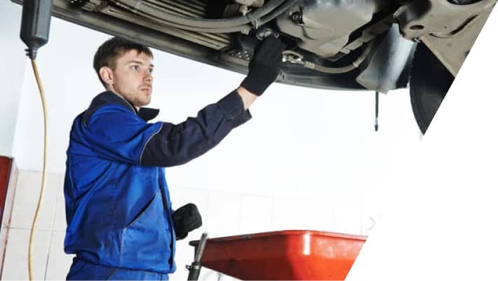car mechanic adjusting brake caliper